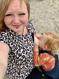 mum breastfeeding in her stylish mum breastfeeding dress uk by stylish mum breastfeeding dress brand