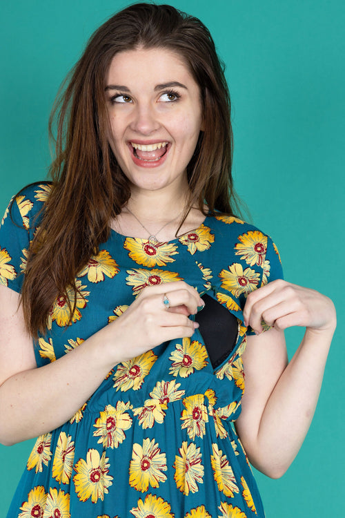 Stylish Breastfeeding Dress showing access via a zip. The dress has a sunflower print. 