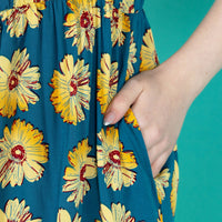Sunflower breastfeeding dress showing a close up of the pocket. 