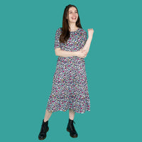 mum posing in breastfeeding midi dress in rainbow leopard print dress